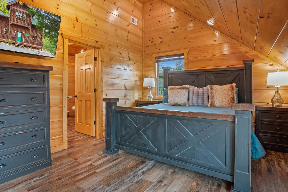 Retreat to the comfort of the cozy king bedroom, designed for a restful and relaxing stay.