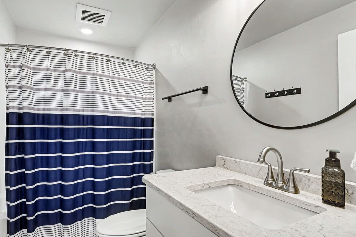 Enjoy the convenience of a spacious full bathroom during your stay. The bathroom provides a comfortable and functional space to freshen up and get ready for the day.