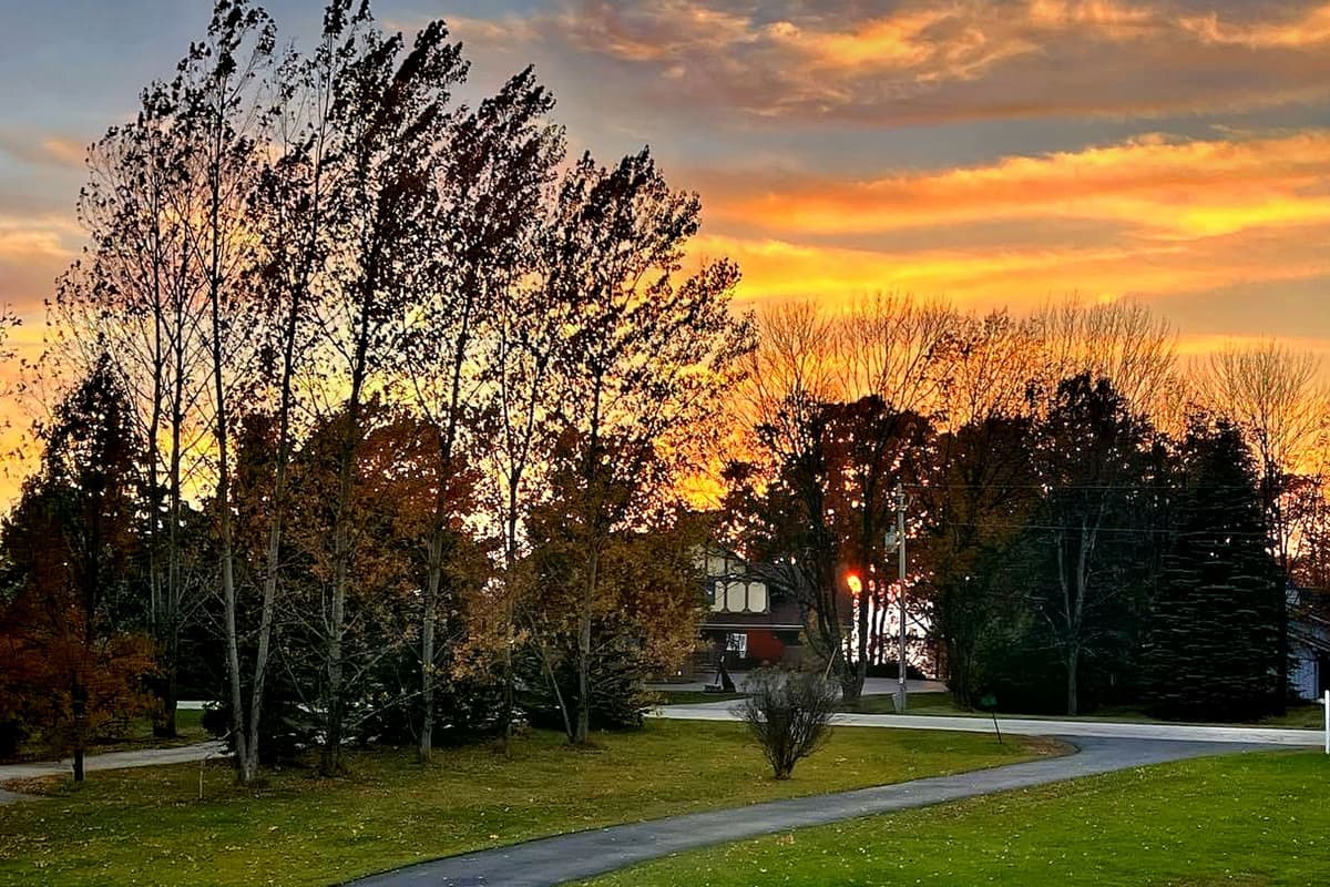 Relax, slow down, and enjoy the peaceful colors of the evening sky as the sun sets over the surrounding landscape.