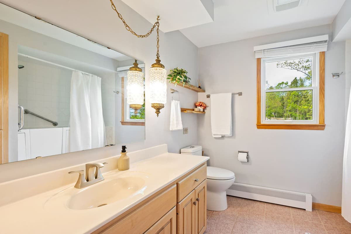 This clean and comfortable bathroom provides a convenient space to freshen up during your stay.