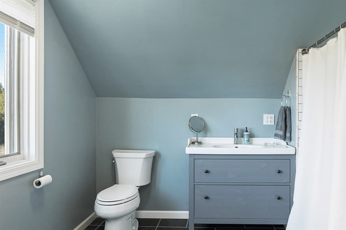 A relaxing, peaceful retreat with a cozy and clean bathroom.