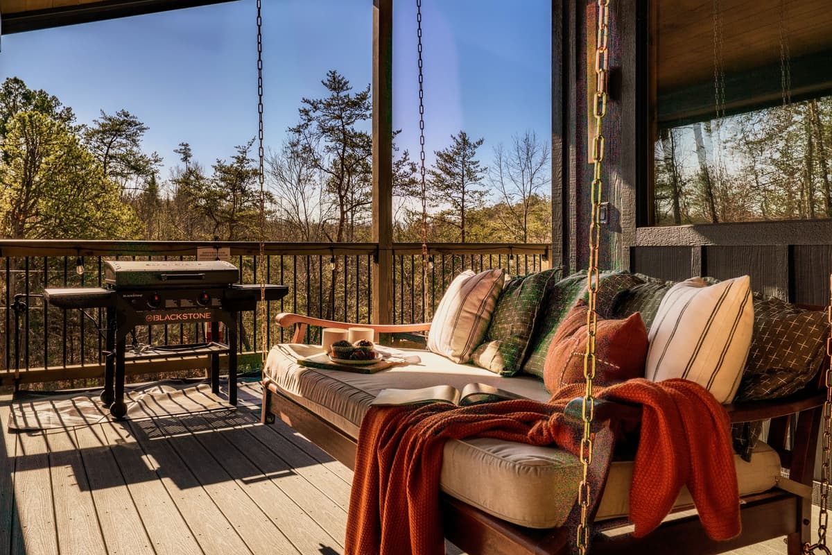 Sway gently in the swing with a cup of coffee in the morning, then unwind in the warm bubbling water after a day of exploring the Smoky Mountains.