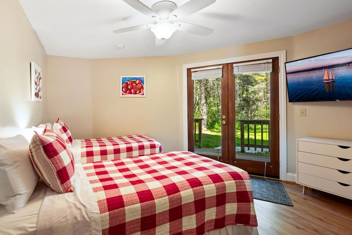 The lower-level bedroom features two comfortable twin beds, making it a great space for children, friends, or additional guests.