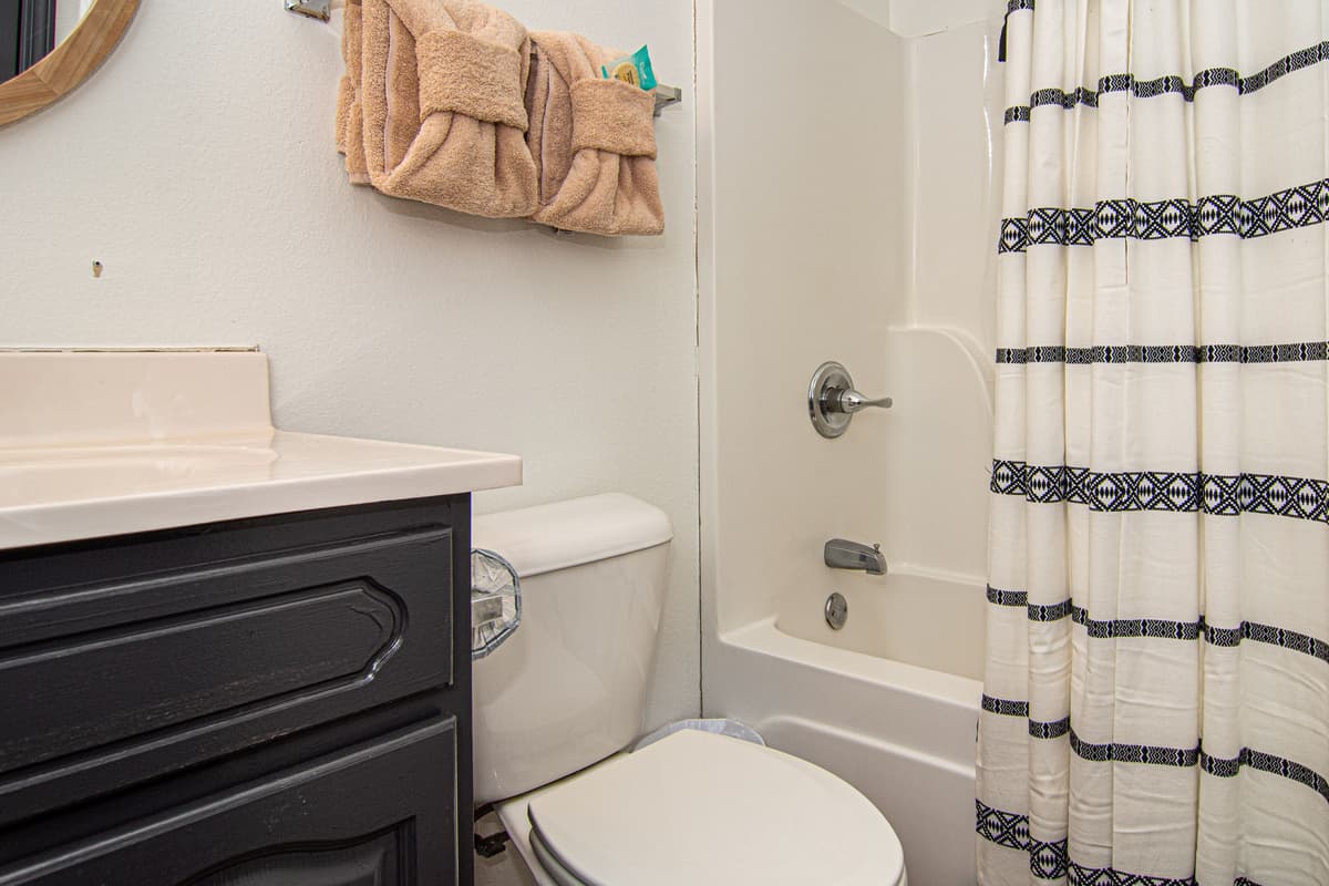 The king bedroom features a private ensuite bathroom for added convenience.
Enjoy easy access to the bathroom without leaving the comfort of your room.