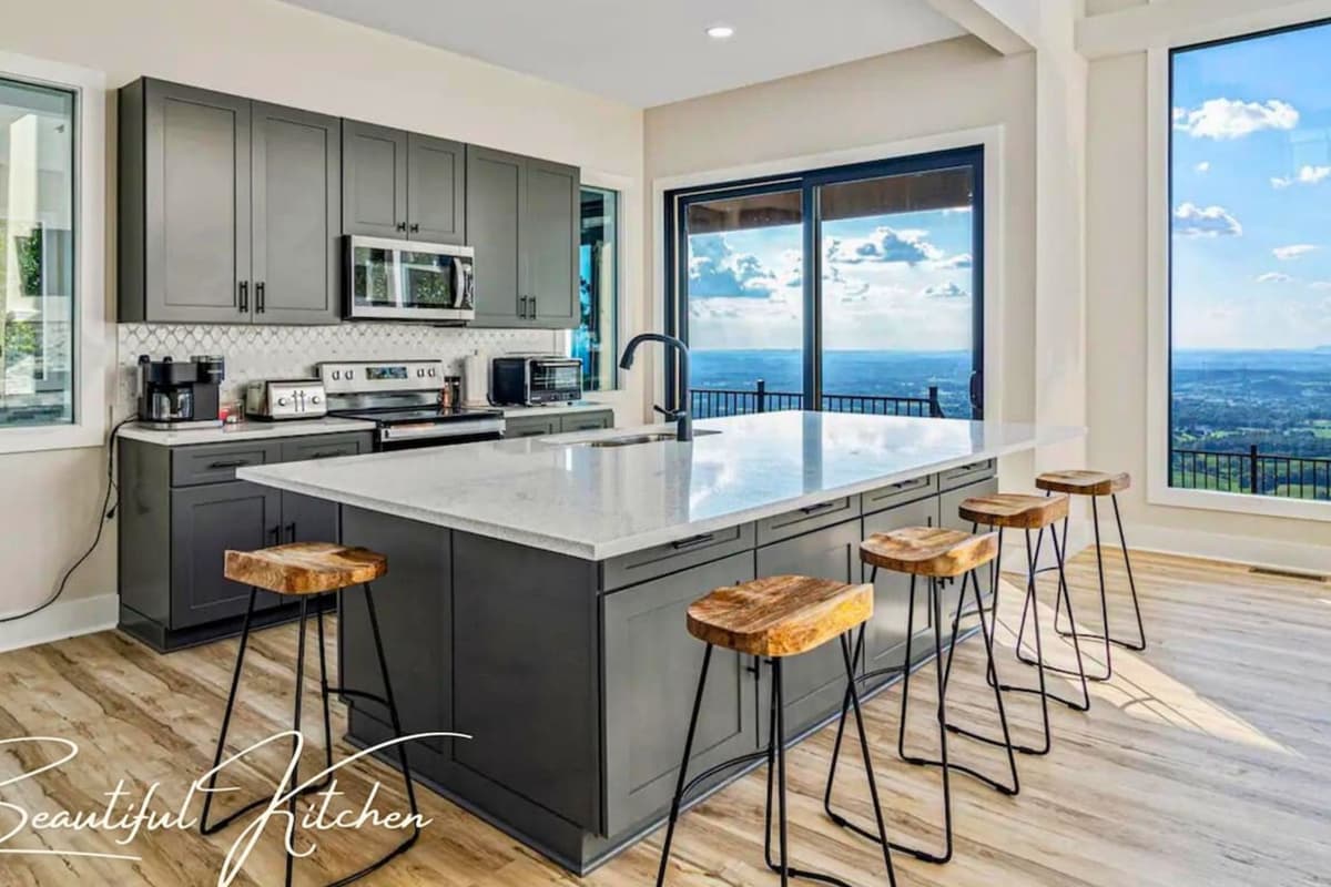 Cook in the well-appointed kitchen, featuring modern stainless steel appliances and everything you need for a comfortable stay.