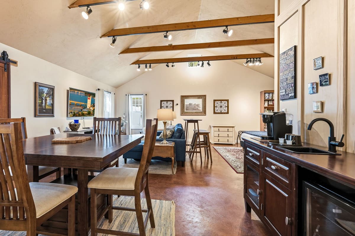 The dining table provides a convenient spot for enjoying meals, morning coffee, or a casual game.