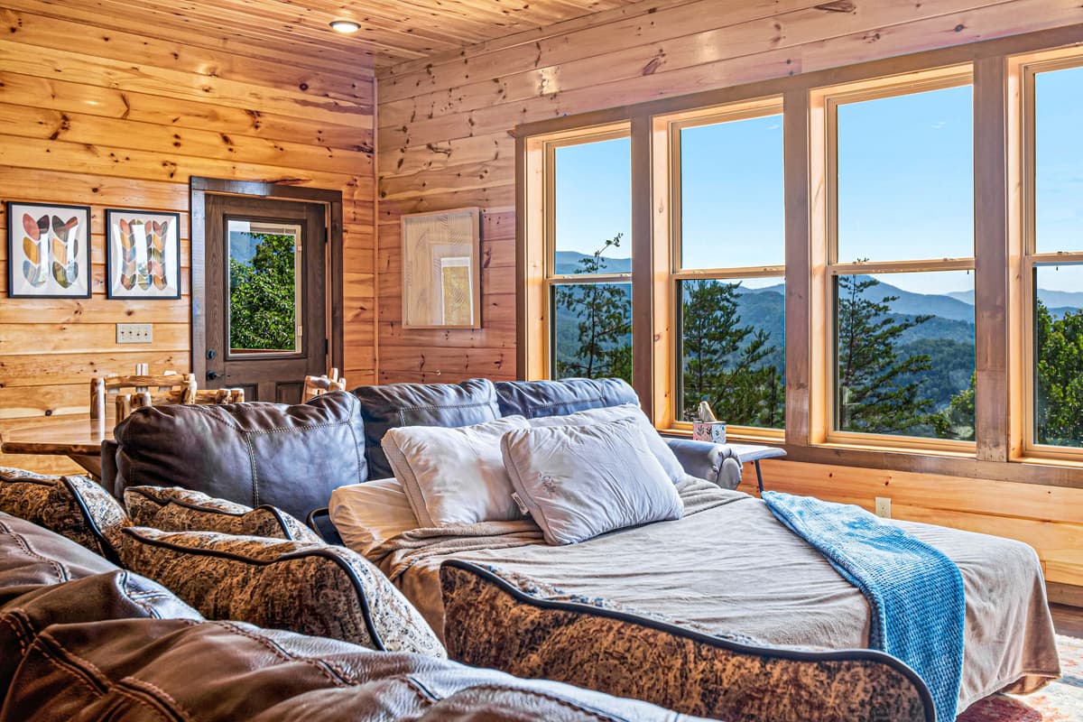 The comfortable living area features a versatile sleeper sofa, offering additional sleeping space when needed.