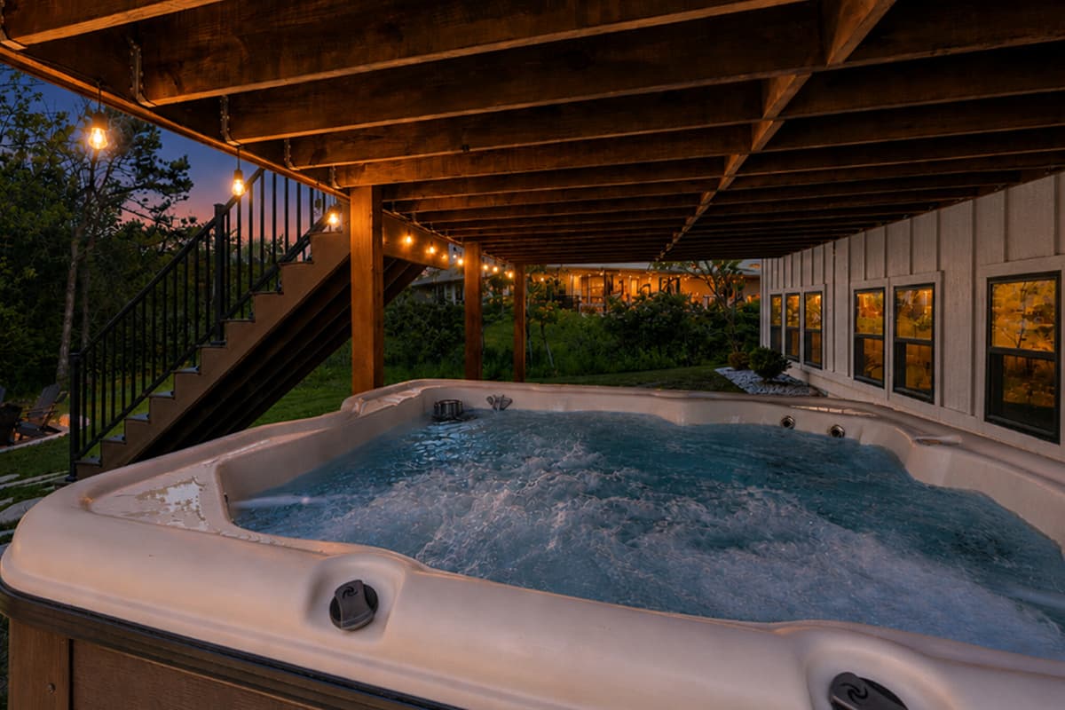 After some time by the fire, continue down to the hot tub for a relaxing soak.