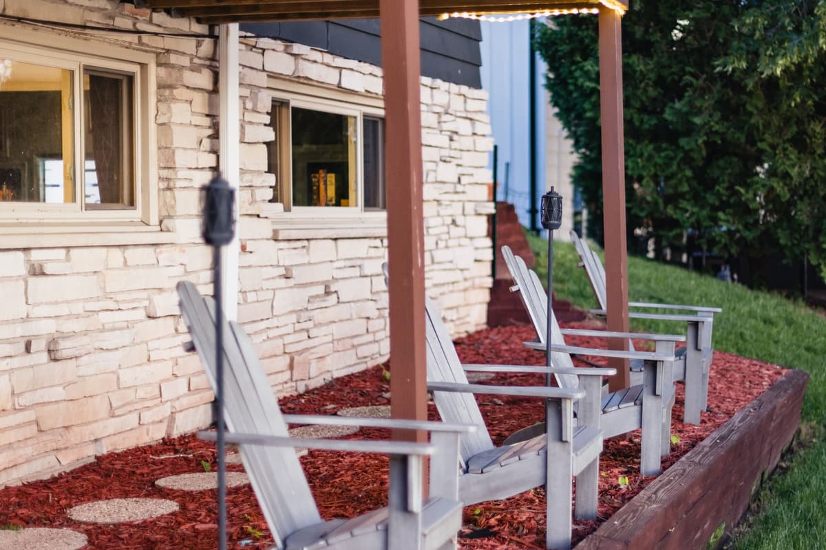 Take a seat in the Adirondack chairs and enjoy beautiful views of the lake. These comfortable chairs offer a peaceful spot to sit back and take in the waterfront scenery.