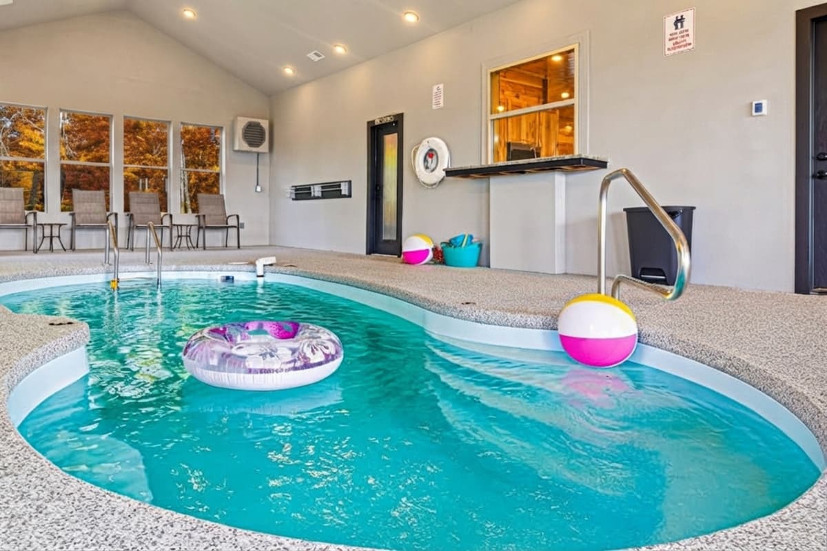 The indoor pool offers year-round fun, while the colorful foliage outside adds a breathtaking seasonal backdrop.