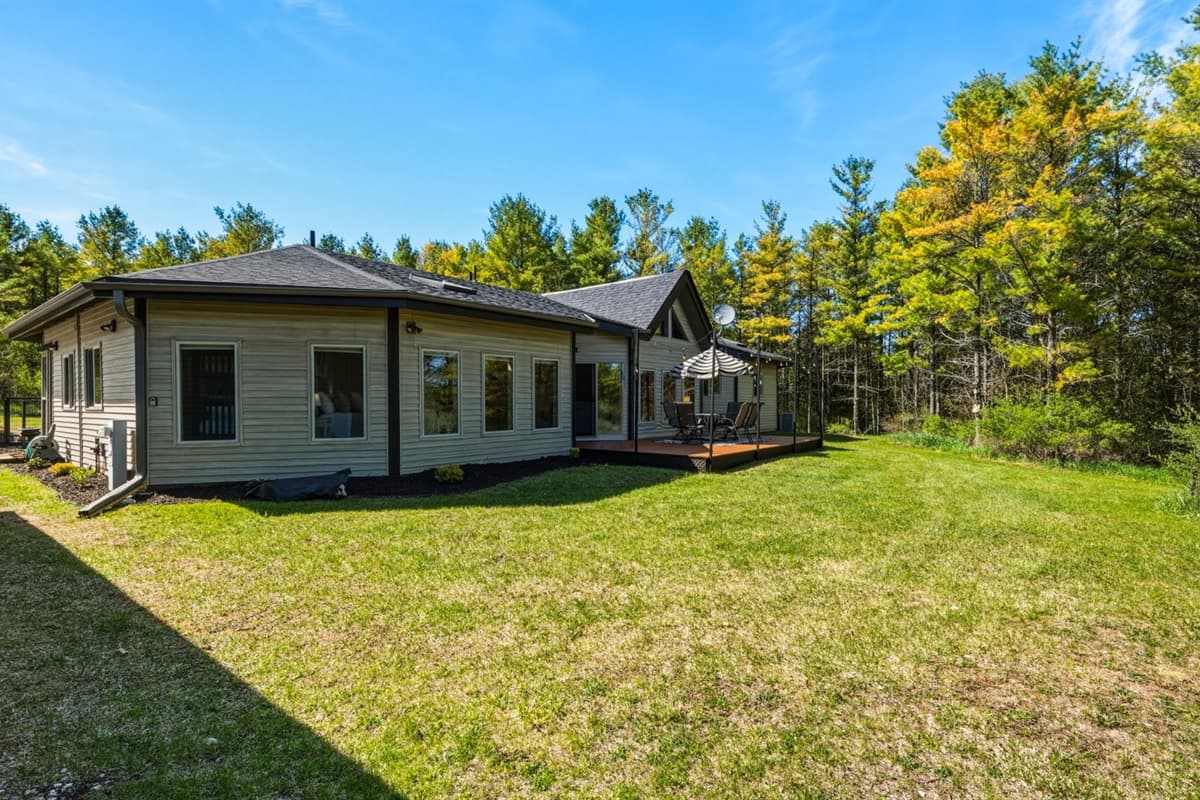 Backyard features a walking trail that offers a peaceful way to explore the natural surroundings right from the property. 