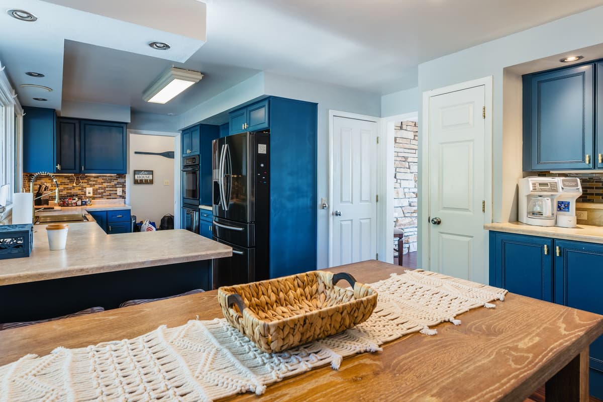 The well-equipped kitchen includes the essentials for cooking, serving, and enjoying meals together.