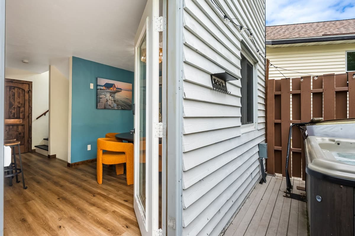 Step outside onto the back deck and enjoy a relaxing outdoor retreat with a private hot tub.