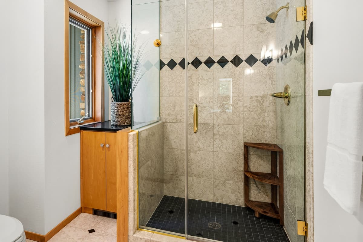 The spacious ensuite bathroom offers privacy and convenience just steps from the bedroom.
