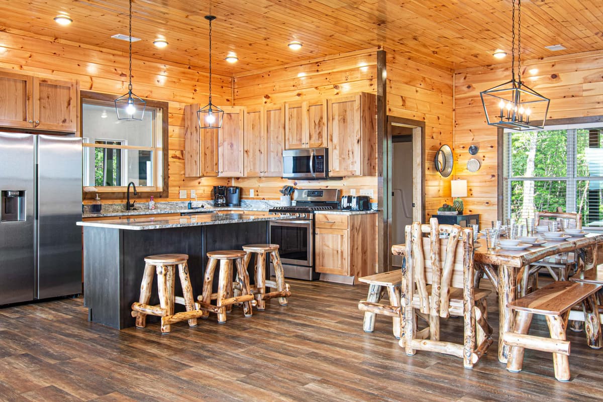 The spacious kitchen and dining area offers a welcoming space to prepare meals, gather, and enjoy time together.