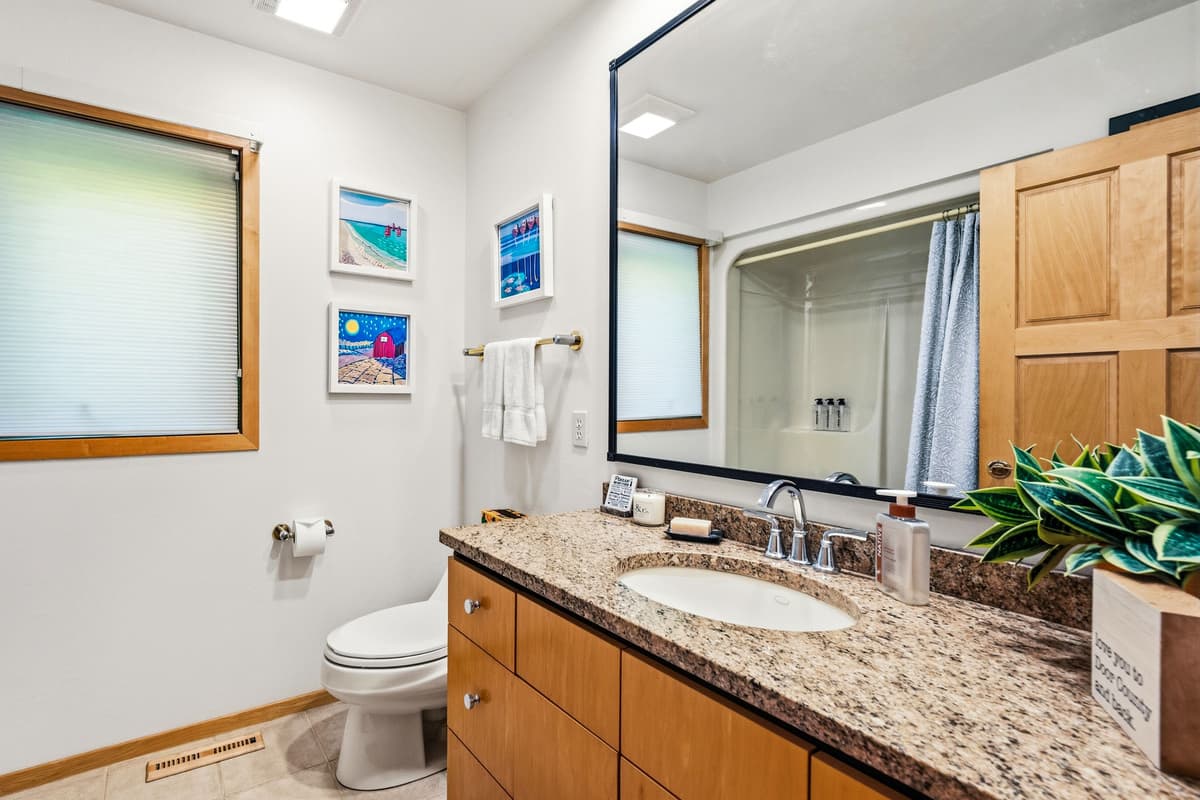 The spacious bathroom provides everything you need to freshen up and get ready for the day.