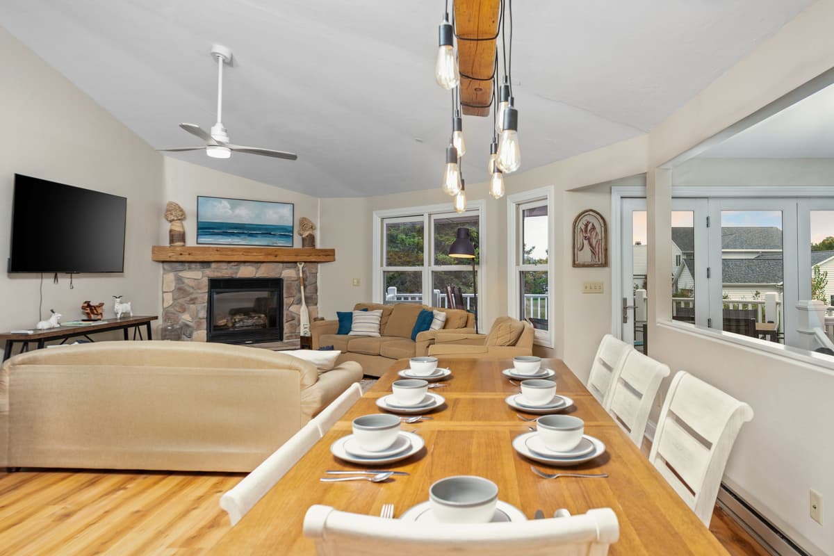 Gather around the spacious dining table with comfortable seating for up to eight guests.