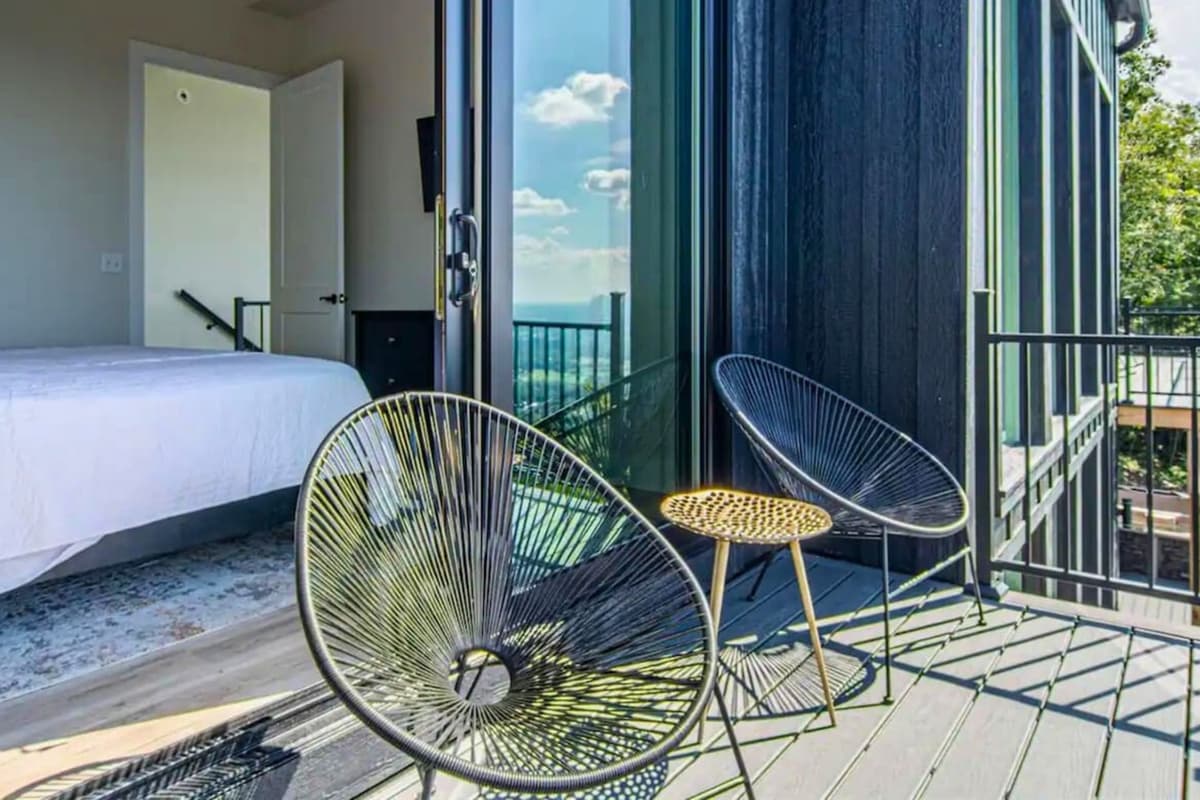 Step outside onto the deck just beyond the room, where comfortable chairs invite you to sit back, relax, and enjoy the surrounding views.
