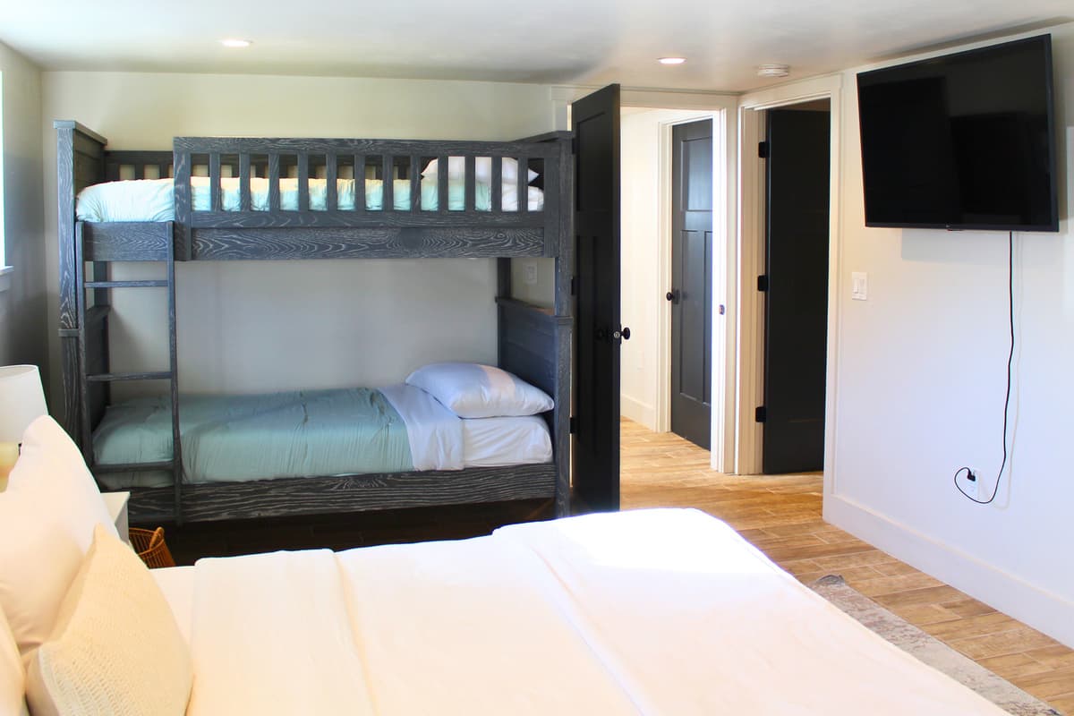 The king bed provides a relaxing retreat for adults, while the bunk beds offer fun and convenient sleeping arrangements for kids.