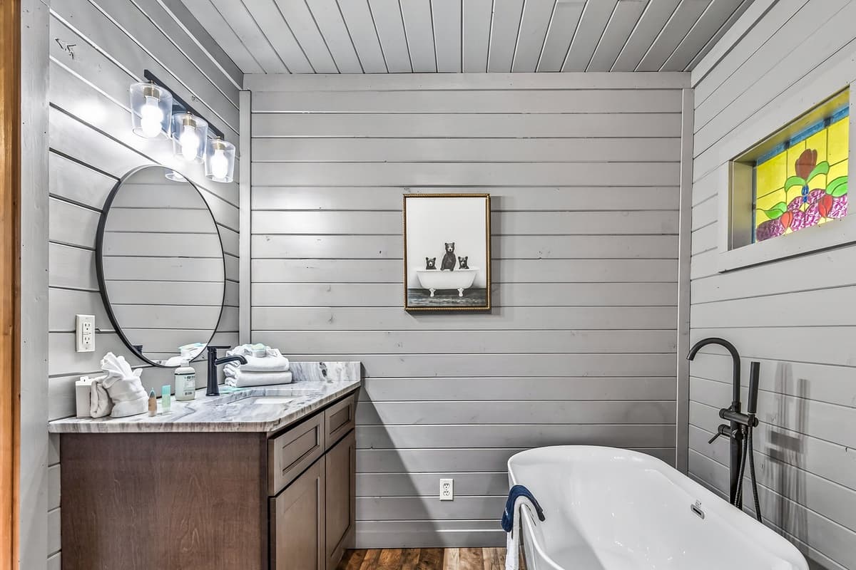 The beautiful freestanding bathtub creates a relaxing space to unwind after a day of mountain adventures.
