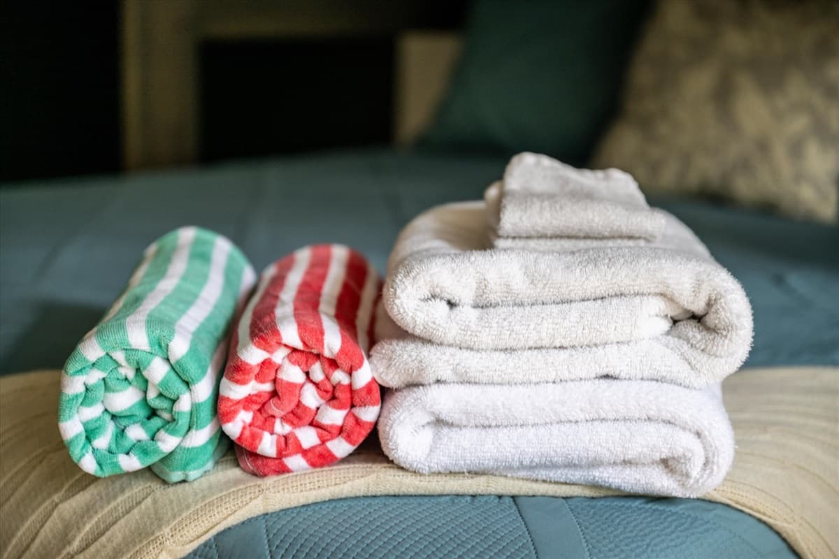 Colorful Striped Hot Tub Towels and White Bath Towels Provided in the Second Bedroom
