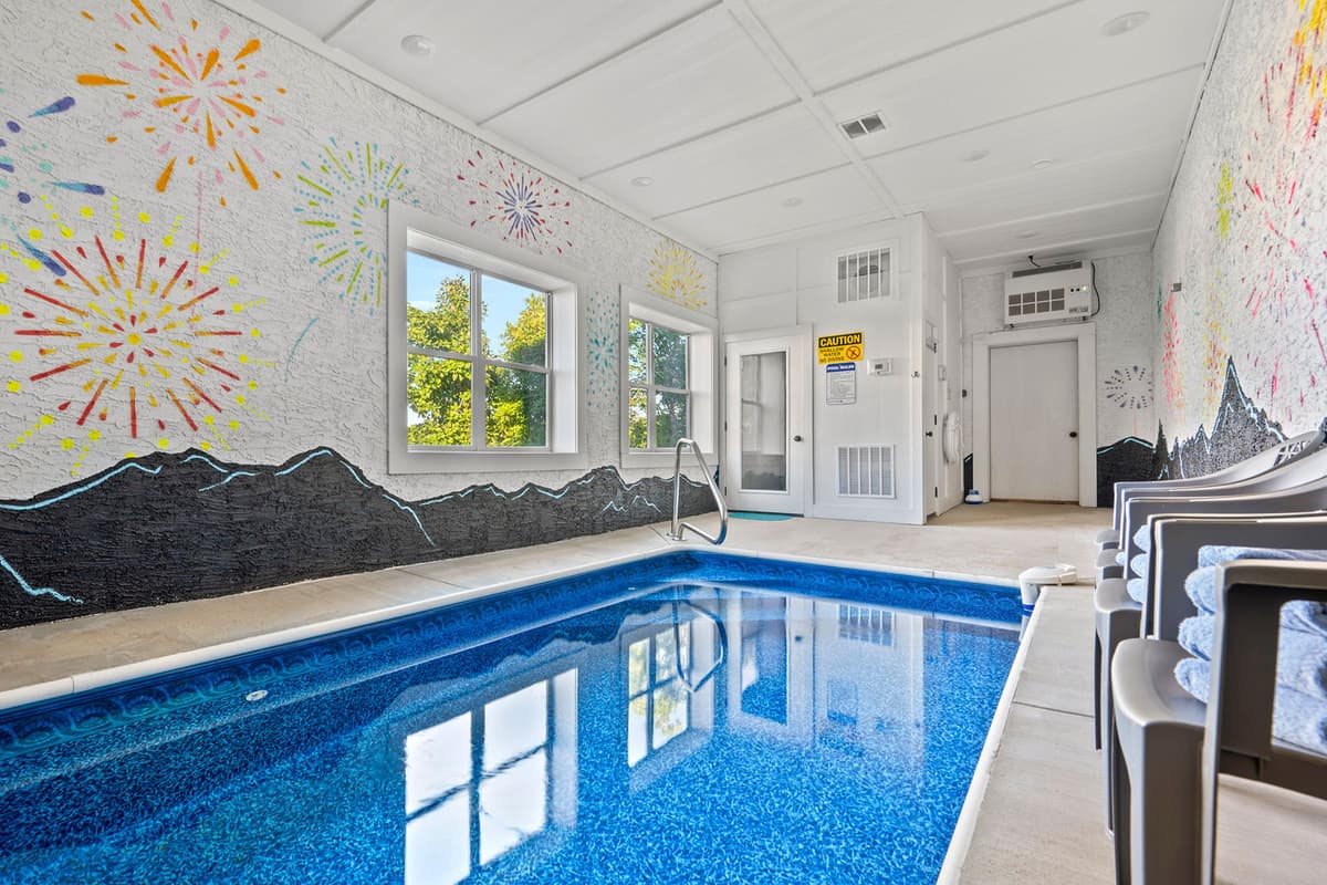 The warm water makes it a wonderful retreat no matter the season. Colorful fireworks décor on the wall adds a playful and festive touch to the space.