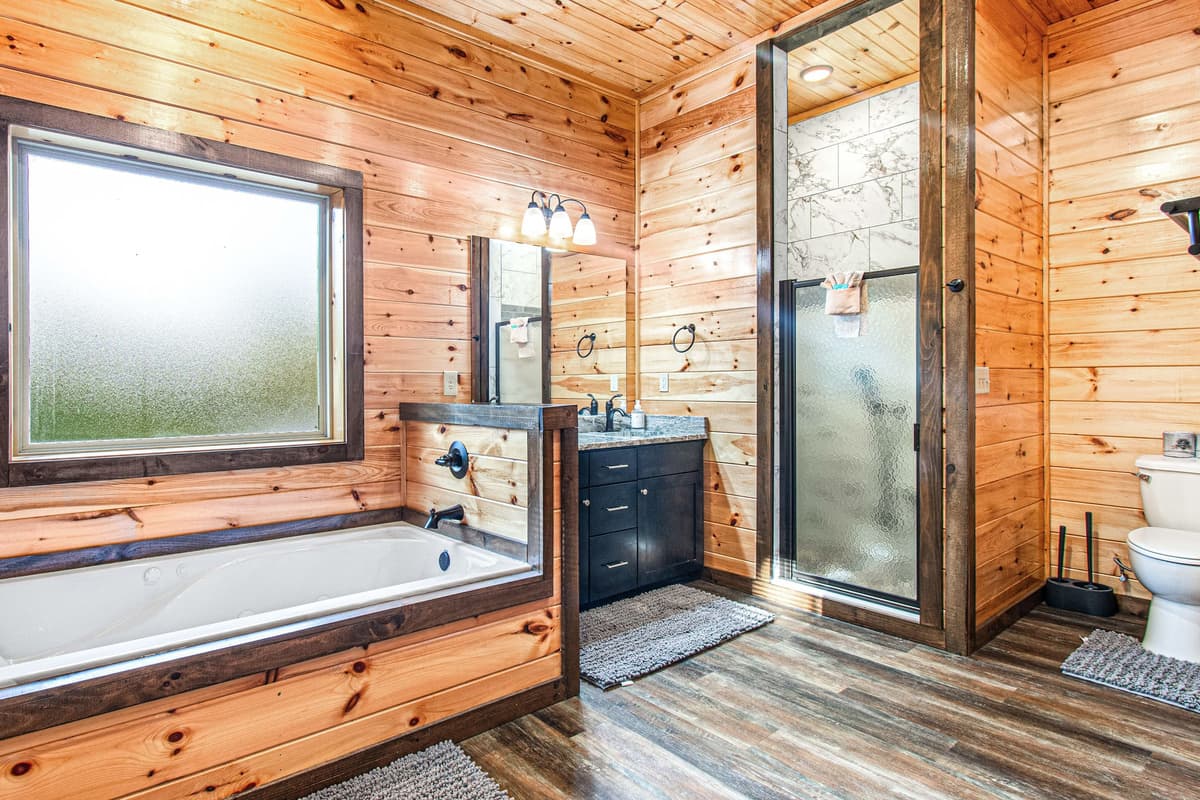 The private ensuite bathroom offers convenience and comfort just steps from the additional king bedroom.