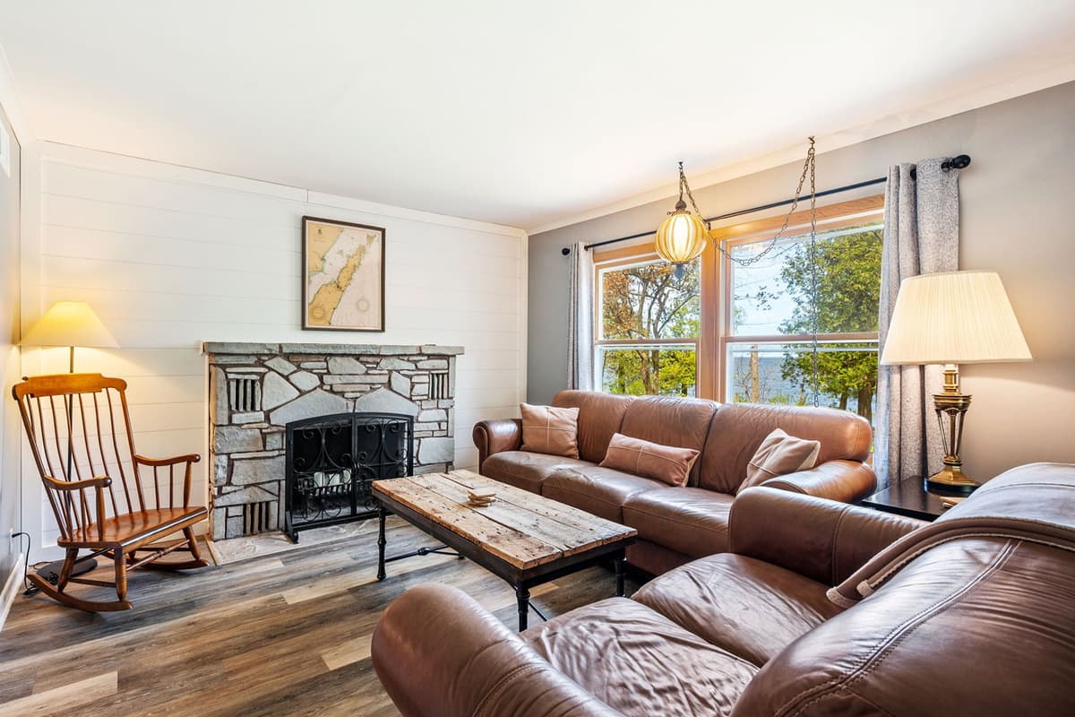 The fireplace creates a warm and welcoming atmosphere, making it a perfect spot to gather with family and friends.