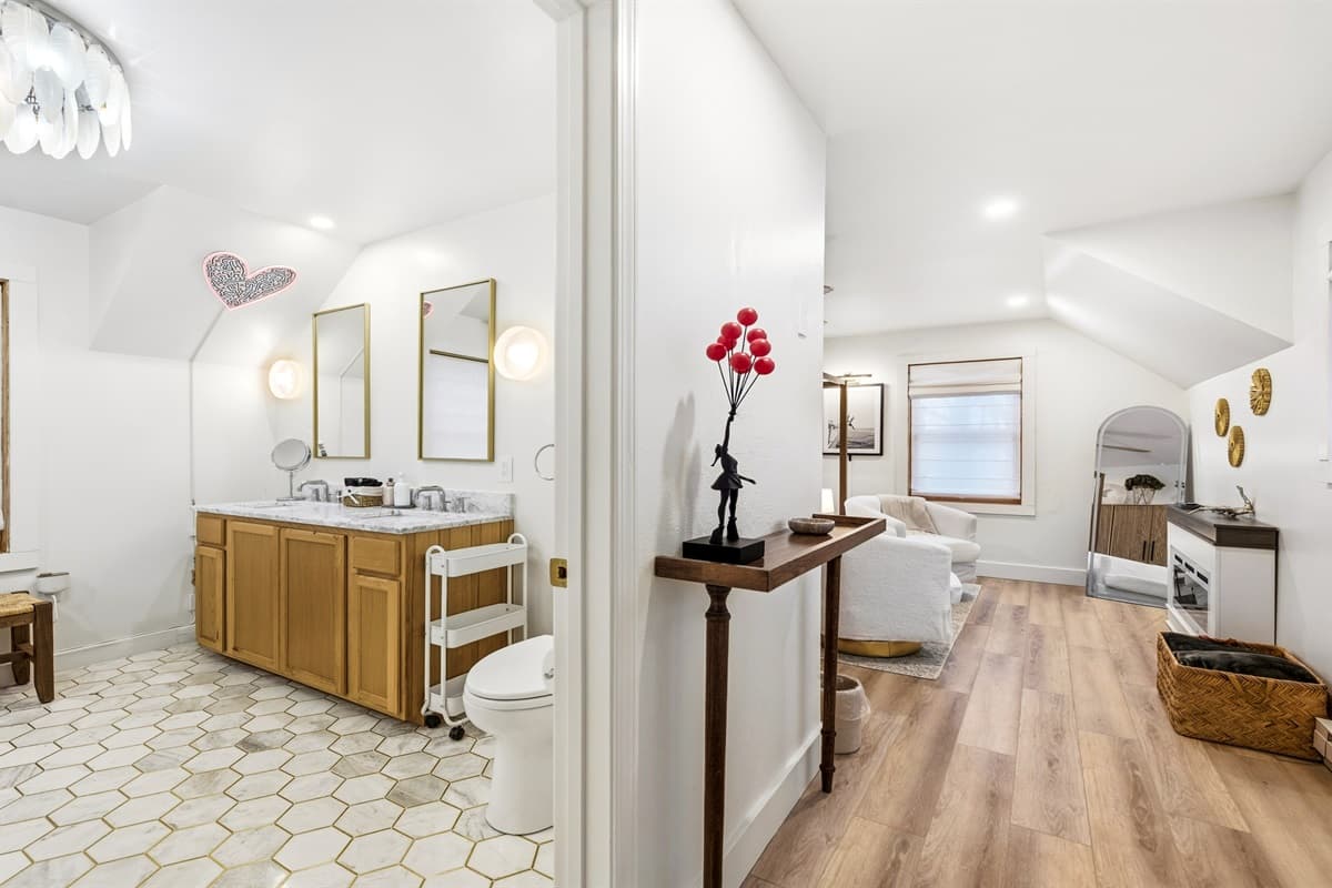 The room's thoughtful details—like ambient lighting and designer touches—create a sophisticated yet cozy retreat where relaxation comes easy.
