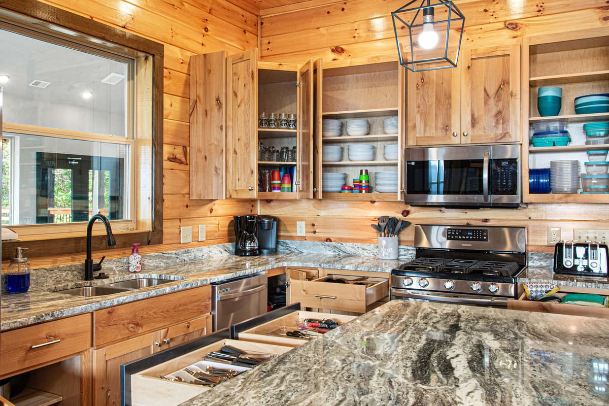 The well-appointed kitchen features sleek stainless steel appliances and everything you need to prepare meals during your stay.