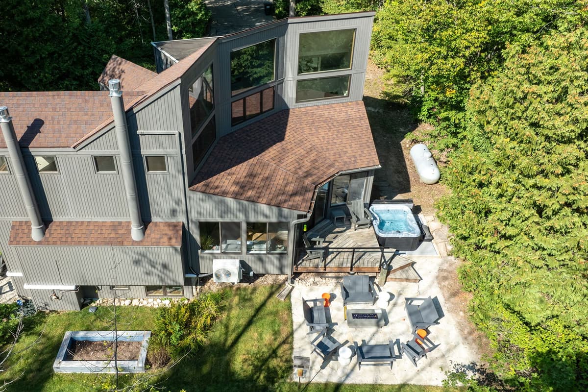 Surrounded by lush greenery, the property offers a peaceful setting for your Sister Bay getaway. T