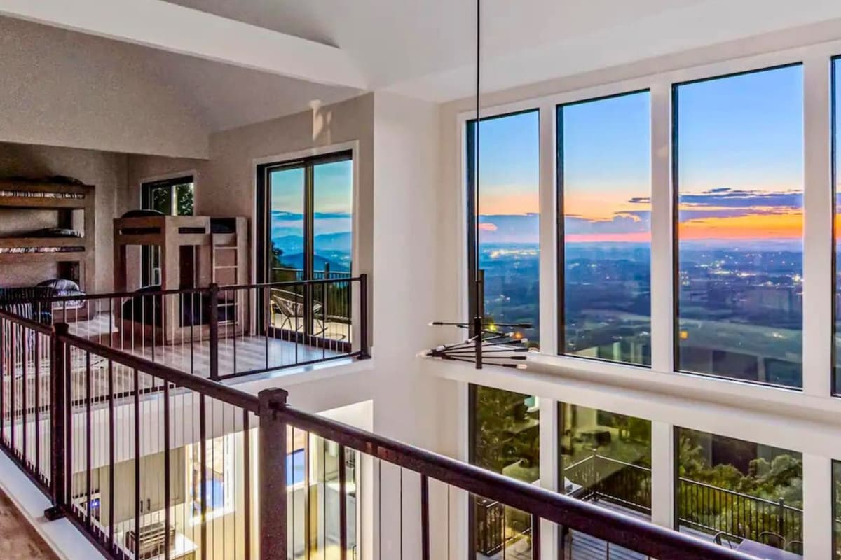 Large windows bring in plenty of natural light, creating a bright and welcoming passage throughout the upper level