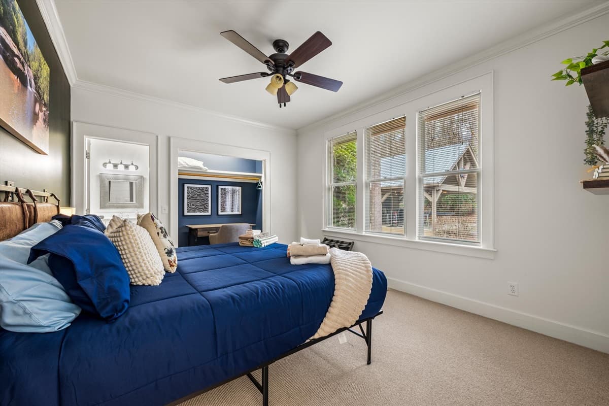 The Room Has a Cozy Queen Size Bed Plus a Ceiling Fan for your Comfort