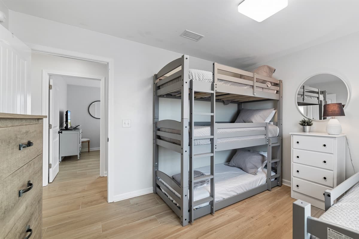 Perfect for the kids, our bedroom features a fun triple bunk bed along with a trundle bed, providing ample sleeping space for the whole family.