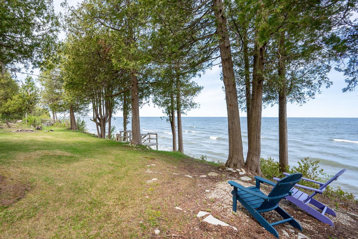 The peaceful waterfront views create a beautiful setting for morning coffee, casual meals, or quiet moments outdoors.