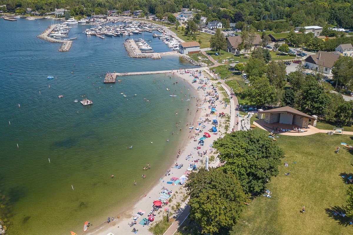 Enjoy the serene beauty of Sister Bay Beach, where soft sand, clear waters, and picturesque sunsets create the perfect escape in Door County!