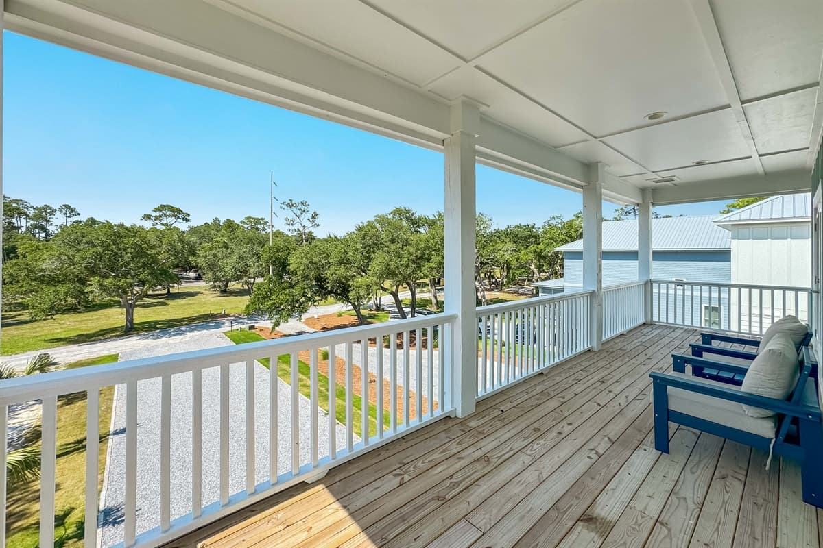 Enjoy the expansive covered deck, featuring comfortable outdoor seating and picturesque views of the surrounding natural landscape.