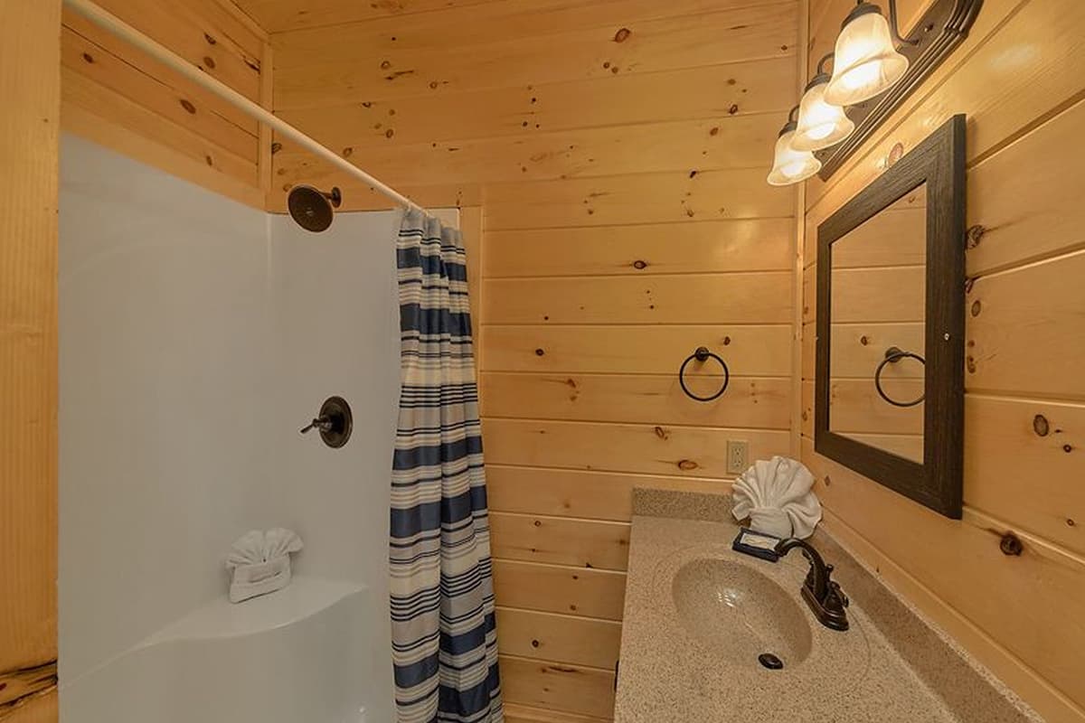 Start your day refreshed and ready for adventure with this bright and comfortable cabin bathroom.