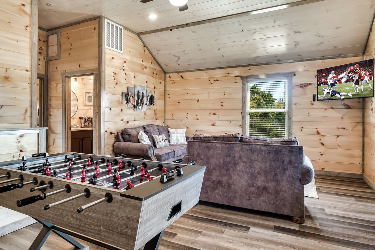 The cozy TV and game room gives everyone a place to gather for movie nights, friendly competitions, or simply lounging between adventures.