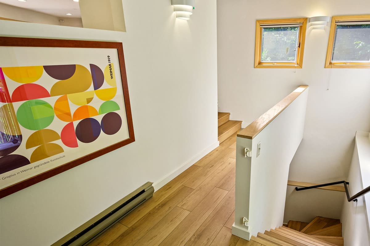 More sleeping space awaits downstairs in the home’s additional bedrooms.