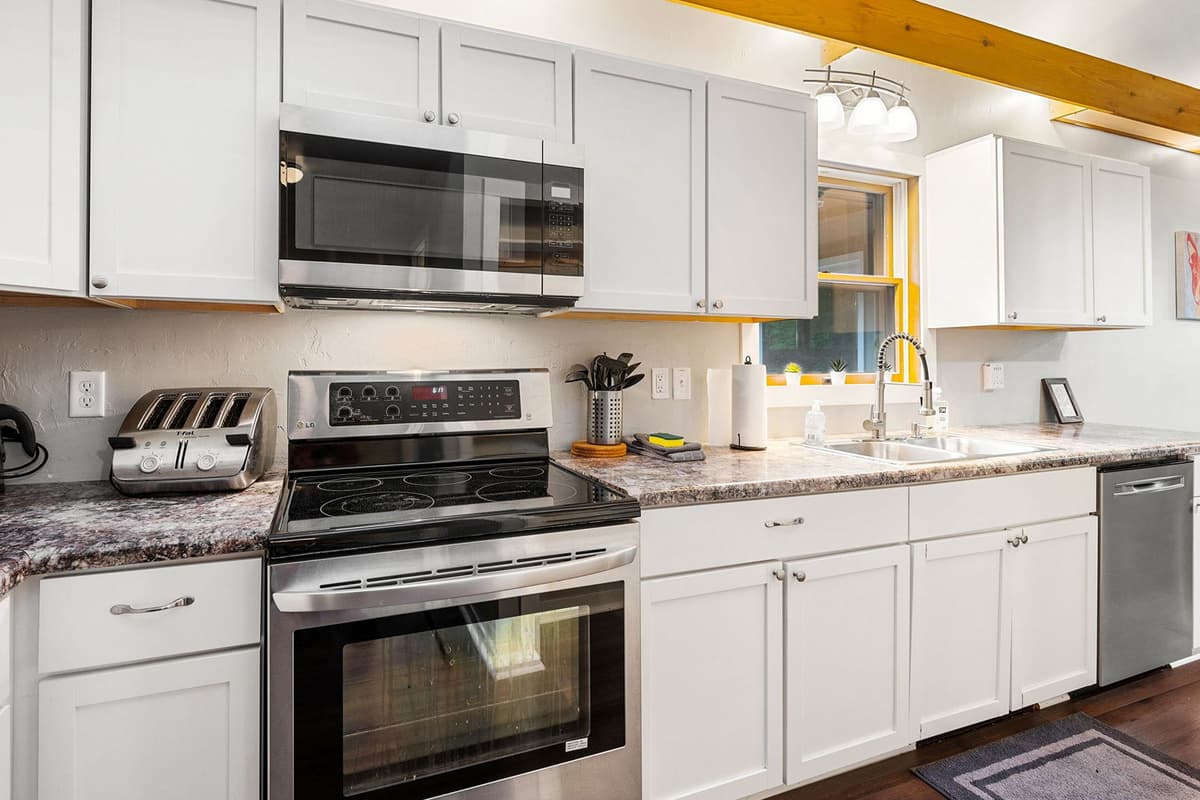The fully stocked kitchen makes it easy to enjoy the comforts of home during your getaway.