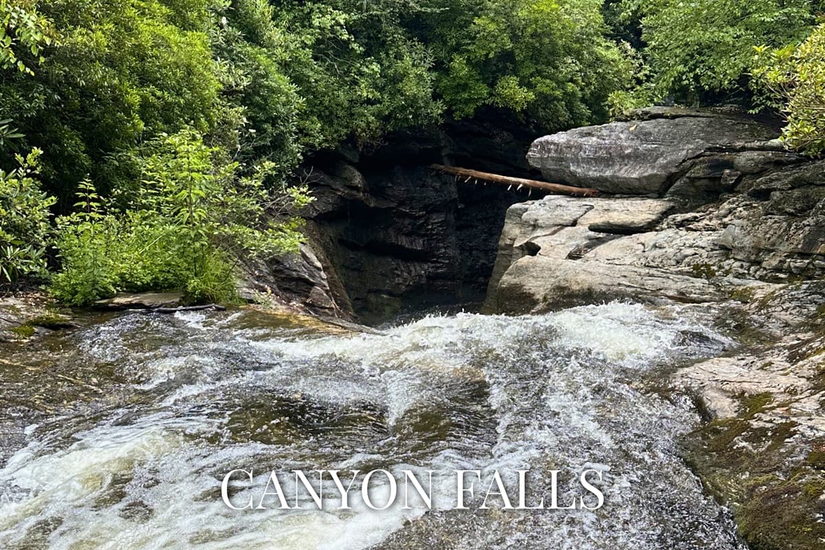 Water carves its way through ancient granite at Canyon Falls - a wild, secluded cascade tucked deep in the canyon, accessible right from the property trail.
