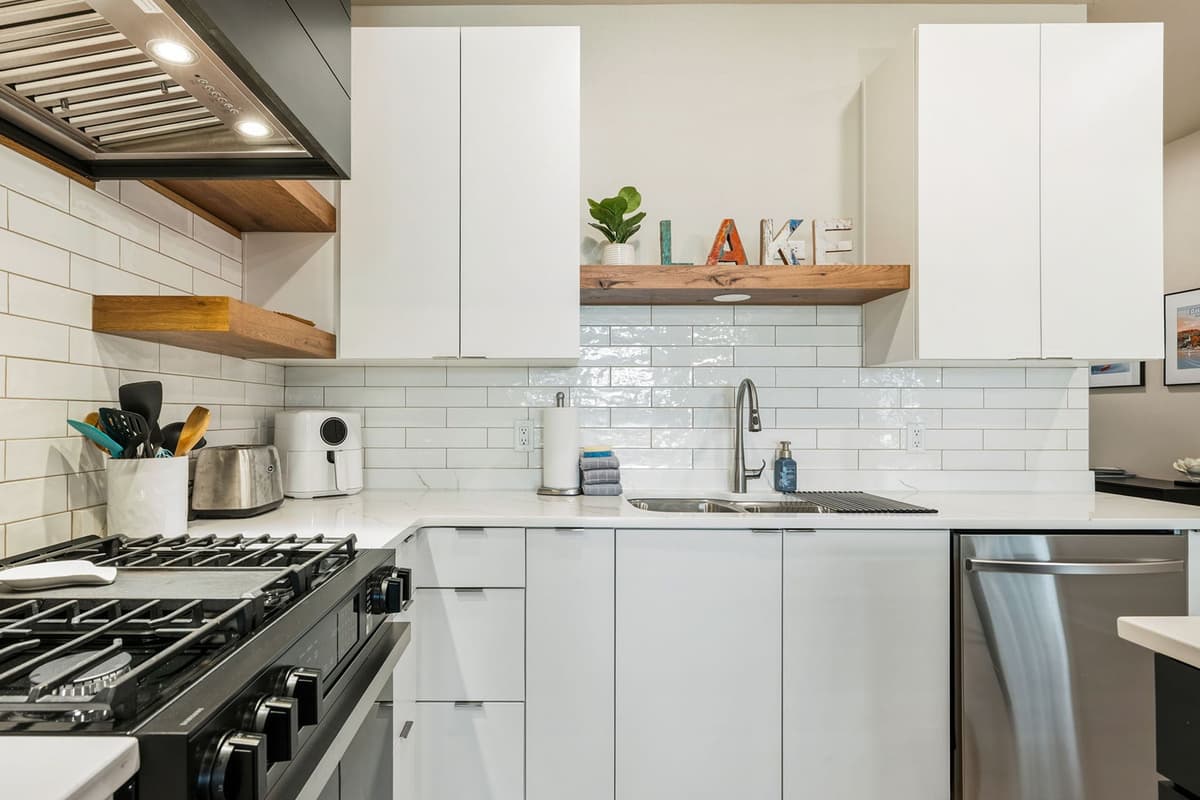 The modern appliances and open layout create a welcoming kitchen that’s perfect for gathering and enjoying time together.
