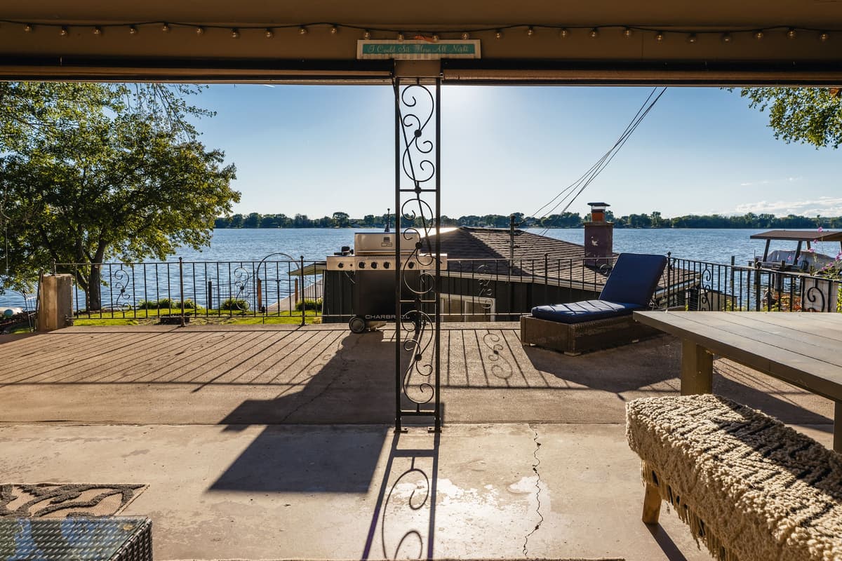 Comfortable seating creates an inviting space for conversation and relaxation. Spend an afternoon enjoying the lake views or an evening sharing stories around the table.