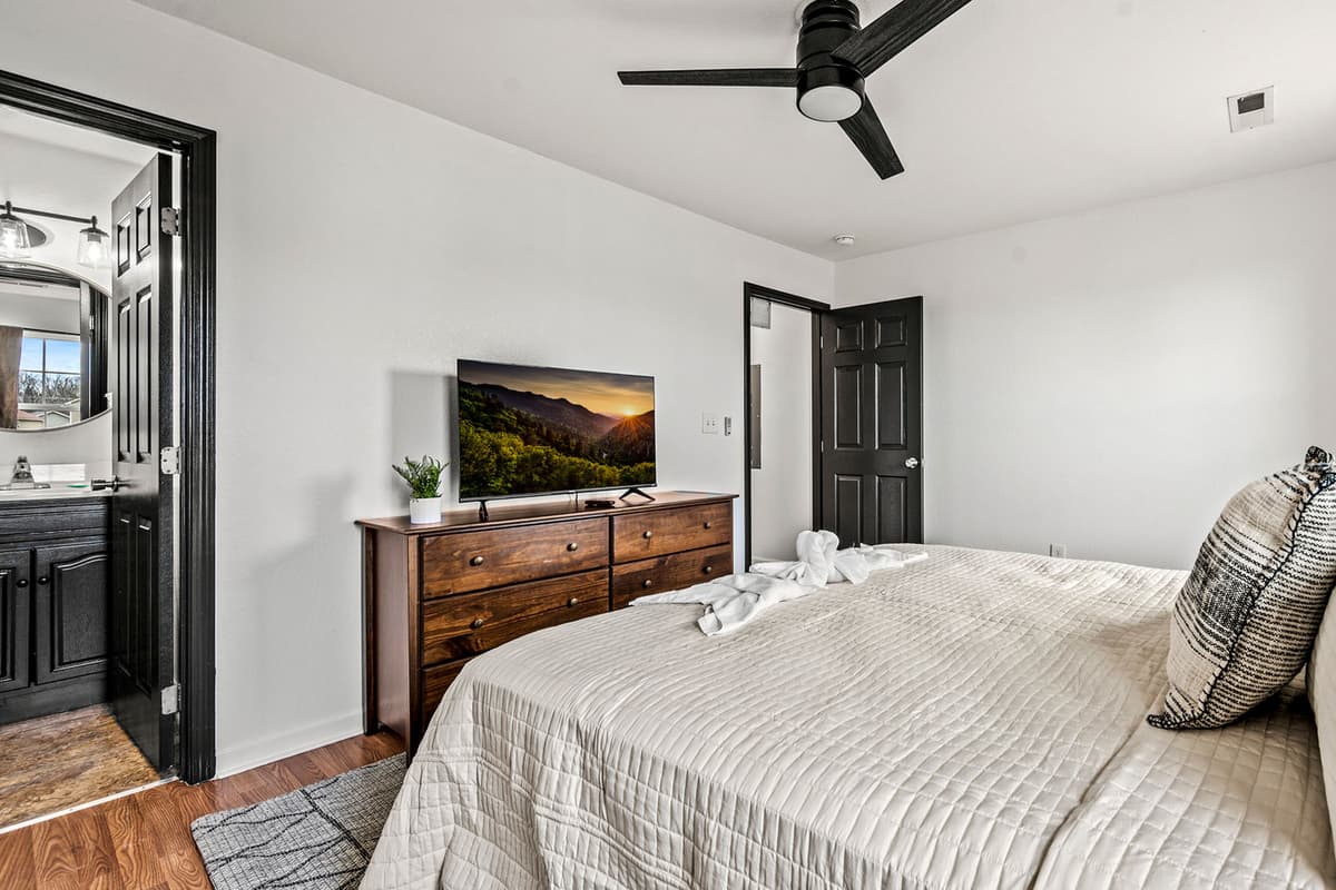 Sink into the comfortable king bed, made with fresh, soft sheets and cozy linens for a restful night’s sleep.