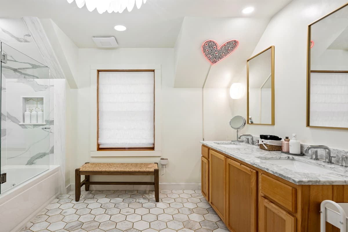 It’s paired with a private ensuite full bath, featuring a luxurious walk-in shower and a jetted Kohler tub—perfect for a relaxing soak after a day of adventure.