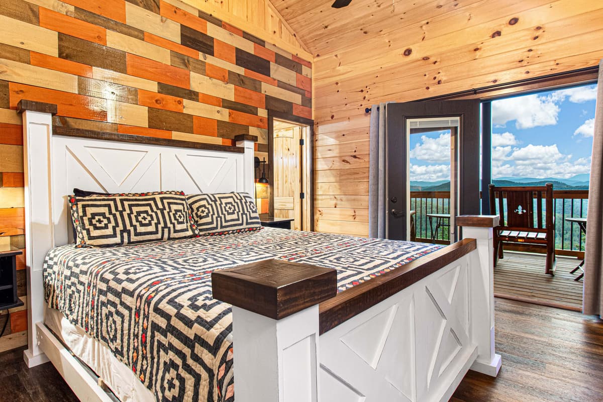 The upstairs king bedroom offers a peaceful and comfortable retreat with a spacious king-size bed and cozy furnishings.