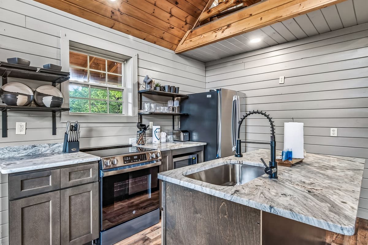 Cook up something delicious in this beautifully appointed kitchen, complete with modern stainless-steel appliances.