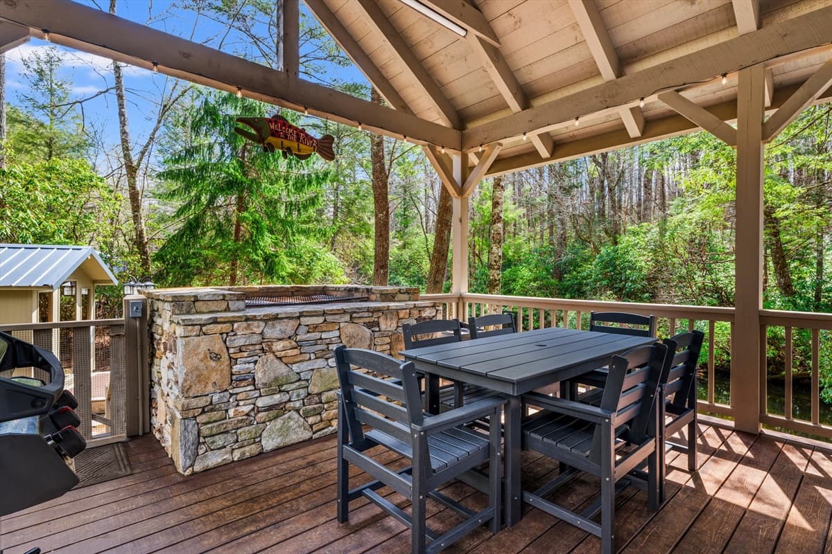 Outdoor Dining Table on the Covered Deck with Stone Charcoal Grill – Bring Your Own Charcoal for a Classic Cookout