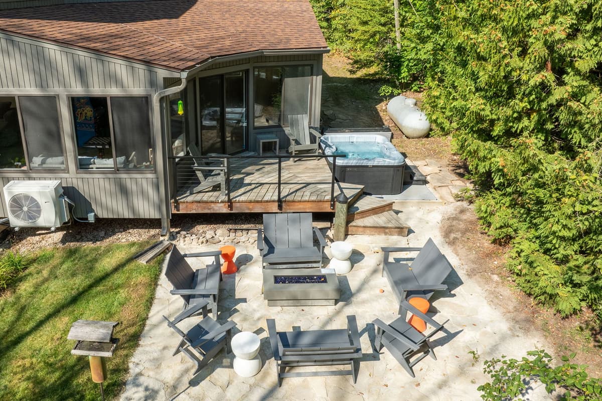 Gather around the outdoor fire table and comfortable seating for a relaxing evening.